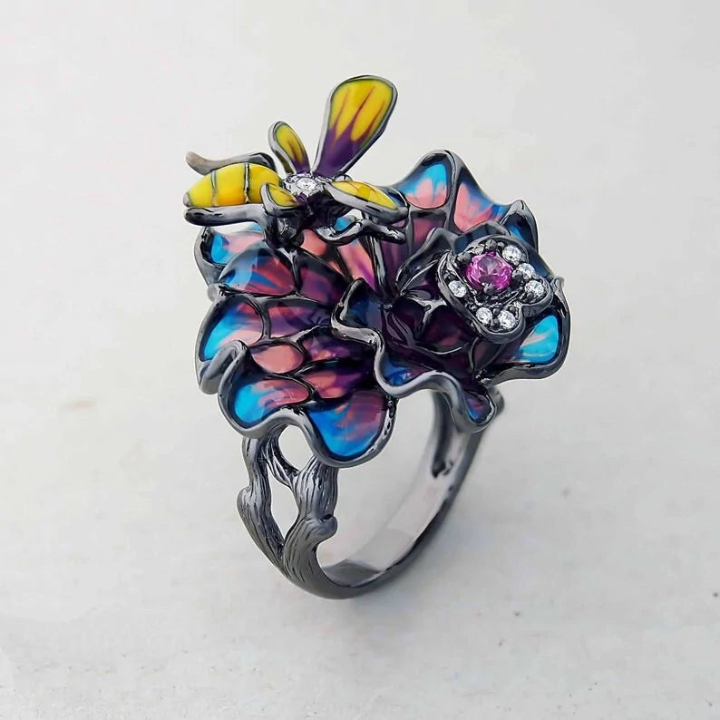 Bee Landing on Peacock Colored Flower WEM Support (www.WEM.support)