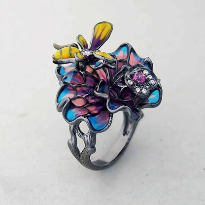 Bee Landing on Peacock Colored Flower WEM Support (www.WEM.support)