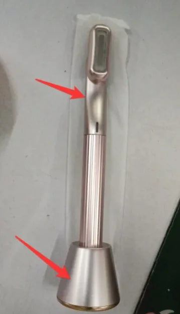 A black and pink 360° Rotary Eye & Face Massager with a rotating head and red LED light