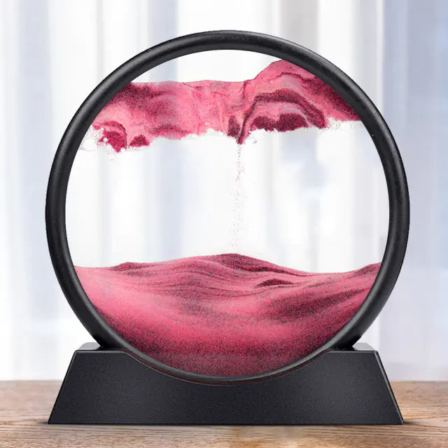 A round 3D hourglass lamp with red sand, set in a black frame on a white base, creating a visual effect of depth and time.