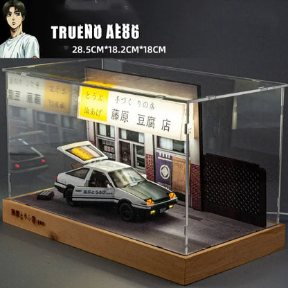 A white alloy car model displayed on a black stand, designed to resemble a real vehicle with detailed features.