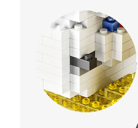 A section of a building constructed from white and multicolored building blocks, resembling a space station module with a visible astronaut figure.