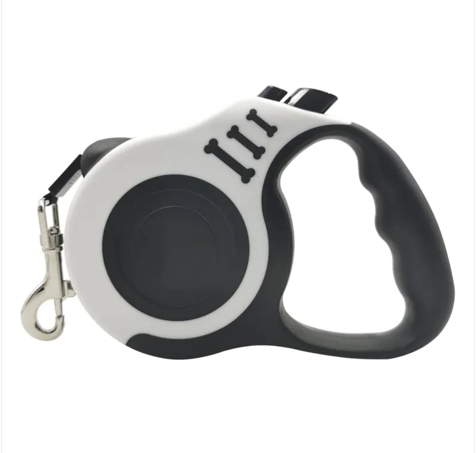 A retractable automatic dog leash with a pink and white bone pattern and a plastic handle.