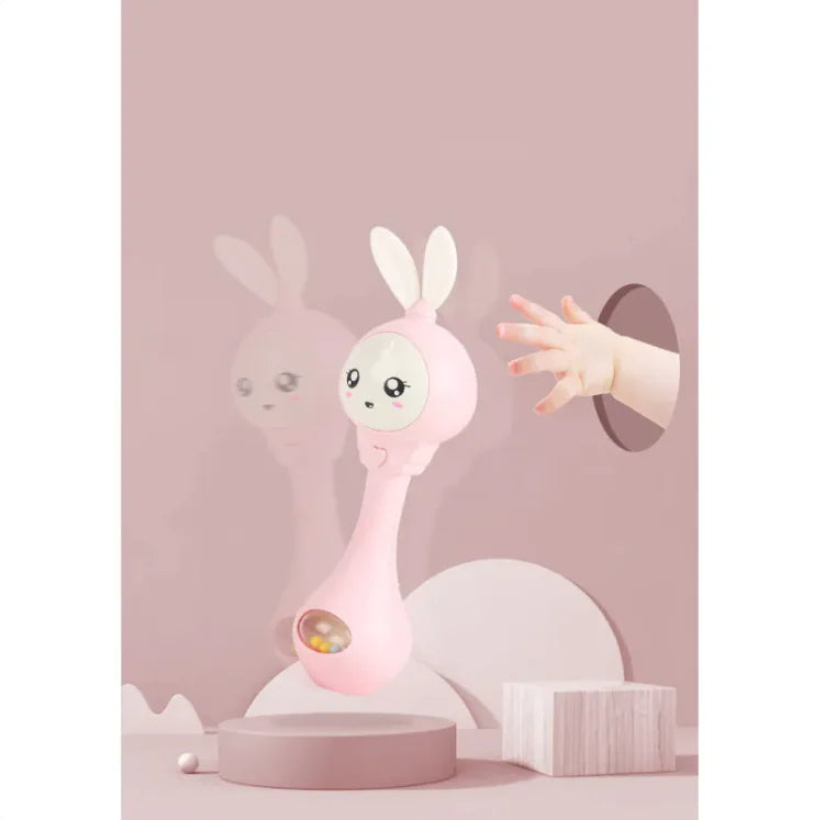 A baby educational chew teether designed to look like a cartoon character. The toy is predominantly light blue with white accents and features a round shape with a handle for easy grip.