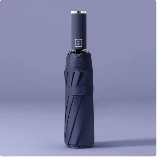 A black folding automatic umbrella with a metallic handle, shown in a closed state.