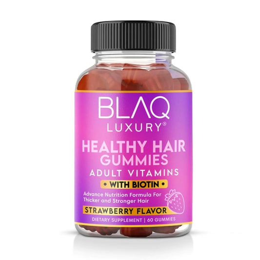 A bottle of Blaq Luxury Healthy Hair Gummies with Biotin, labeled as a dietary supplement for thicker and stronger hair, strawberry flavor, with 60 gummies inside.