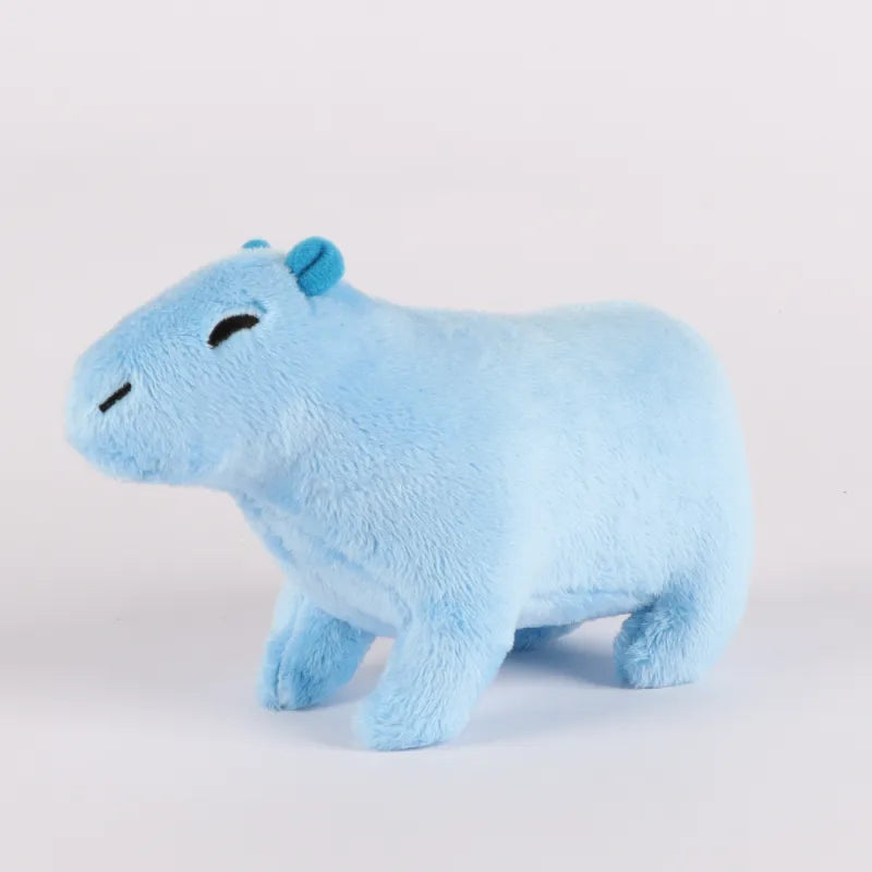 A plush toy resembling a blue capybara, with a soft and fluffy texture, positioned against a neutral background.