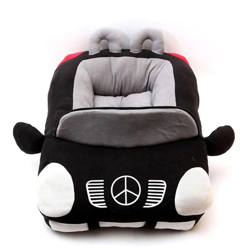 A black and gray car-shaped pet nest with a plush interior and a peace sign design on the front