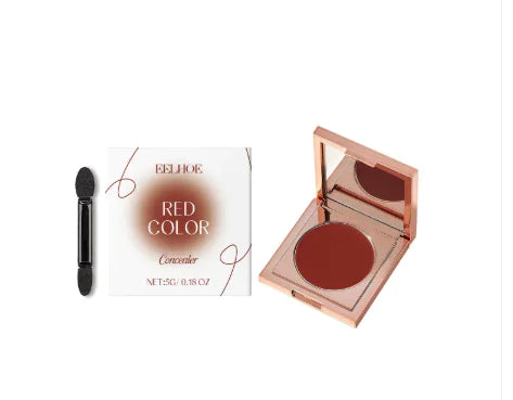The image shows a concealer product with a compact case and a spoon applicator. The packaging is rose gold and white colored with text and product name, and the product is described as 'Ivory White'.