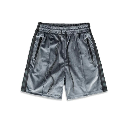 A pair of gray suede sports webbing shorts with a mid-waist design, side pockets, and a drawstring waistband.