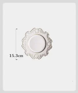 A white porcelain dinner plate with a Baroque European-style floral pattern on the edge, measuring 15.3 cm in diameter.