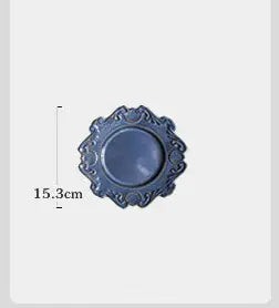 A white porcelain dinner plate with a Baroque European-style floral pattern on the edge, measuring 15.3 cm in diameter.