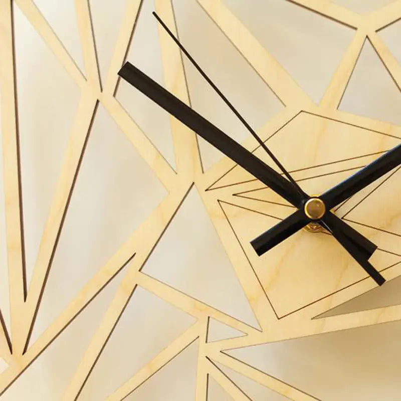 A close-up view of a wooden wall clock with a geometric pattern and black hands.