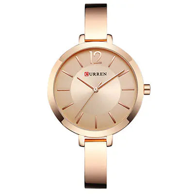 A rose gold Curren quartz watch with a steel strap and a dial displaying the time in a analog format.