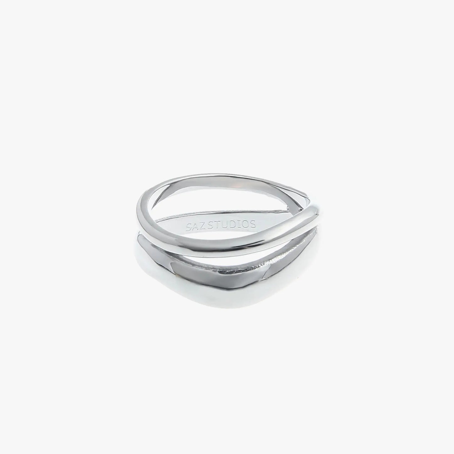 A double layered silver fashion ring with an irregular geometric design, displayed against a white background.
