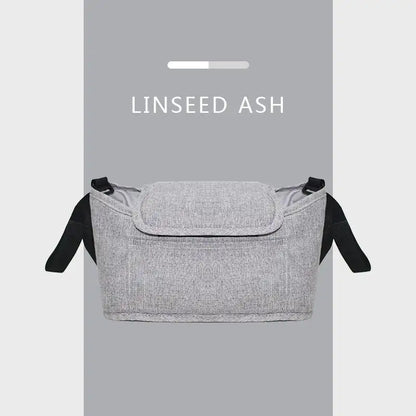 Gray fabric bag with black straps on a gray background, labeled 'LINSEED ASH'.