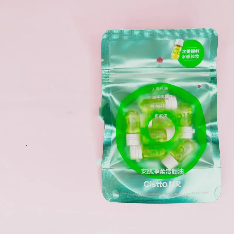 A packaged Eye & Lip Cleansing Cream product featuring visible green oil pills inside a transparent plastic pouch with a white and green label.
