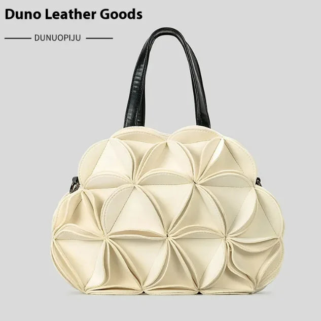 A black flower-shaped shoulder bag with PU stitching details, displayed against a white background.