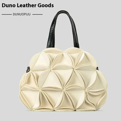 A black flower-shaped shoulder bag with PU stitching details, displayed against a white background.