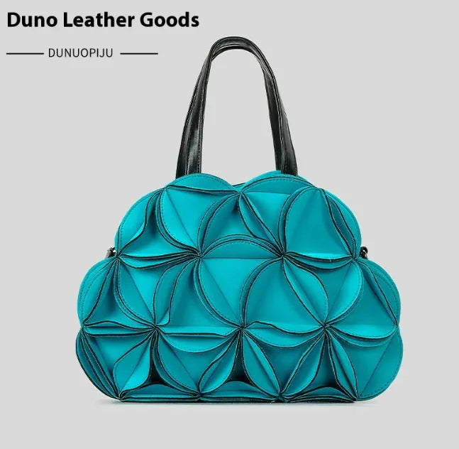 A black flower-shaped shoulder bag with PU stitching details, displayed against a white background.