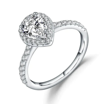 A sterling silver ring with a central diamond inlay surrounded by smaller gemstone inlays on the band.