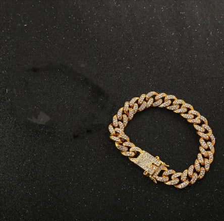 A man's wrist wearing a silver rhinestone bracelet with a floral design.