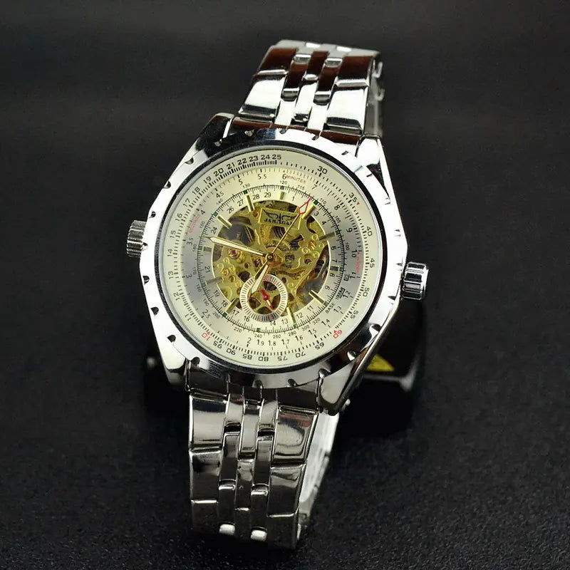 A men's hollow automatic mechanical watch with a silver steel band and a silver dial, showcasing a hollow-out design.
