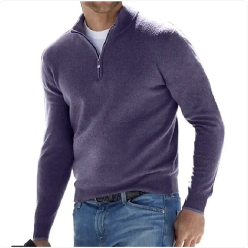 A man wearing a long-sleeve cashmere undershirt in purple with a collar, paired with blue jeans.
