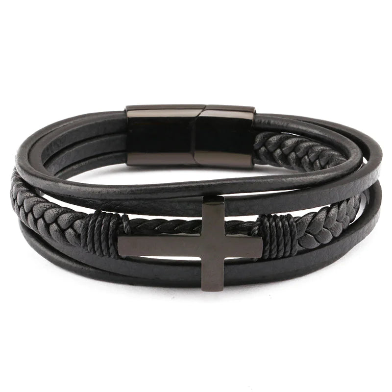 A men's retro braided leather and steel bracelet with a black color scheme, featuring a metallic clasp and a geometric pattern on the cross symbol, displayed on a wooden surface.