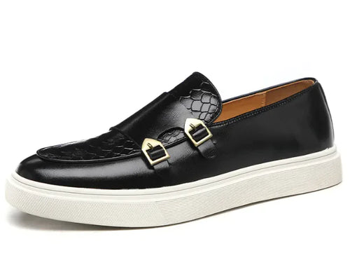 A black casual leather shoe for men featuring a slip-on design with a decorative buckle and a white sole.