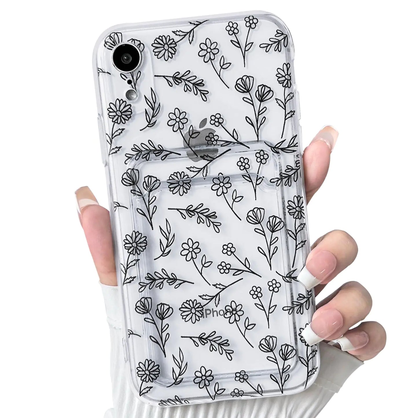 A hand holding a clear iPhone case with a floral leave pattern