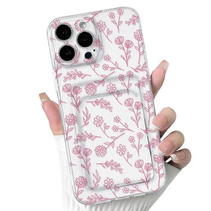 A hand holding a clear iPhone case with a floral leave pattern