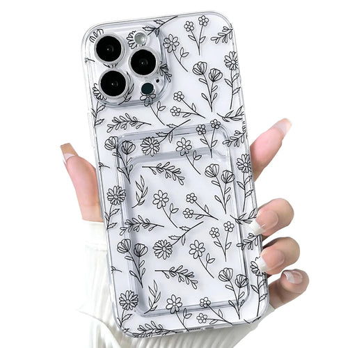 A hand holding a clear iPhone case with a floral leave pattern