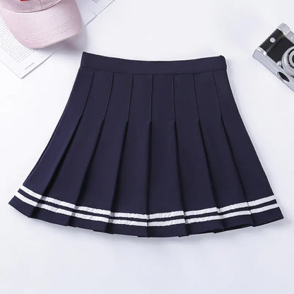 A pleated, half-length skirt with a striped elastic waistband in a pink color.