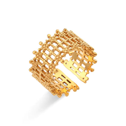 A gold-colored stainless steel woven ring with an adjustable band.