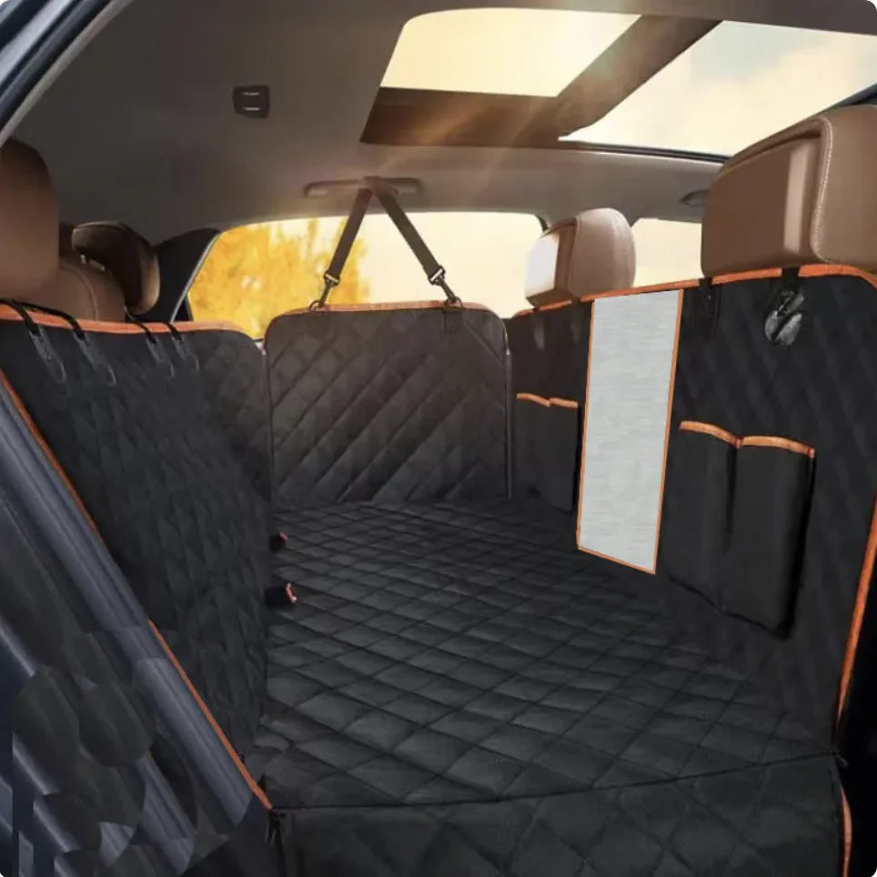 A black Oxford cloth car pet seat cover with orange edges installed in the back seat of a vehicle, featuring a double pocket design.