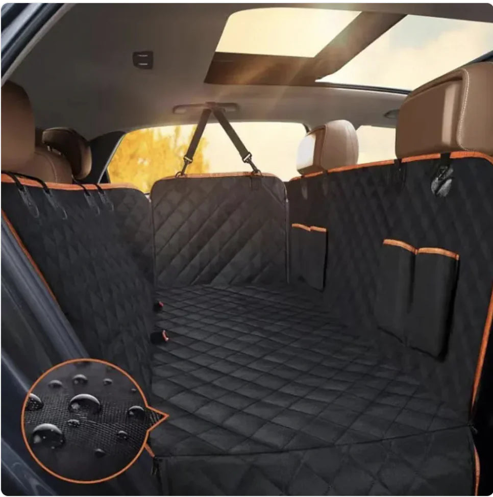 A black Oxford cloth car pet seat cover with orange edges installed in the back seat of a vehicle, featuring a double pocket design.