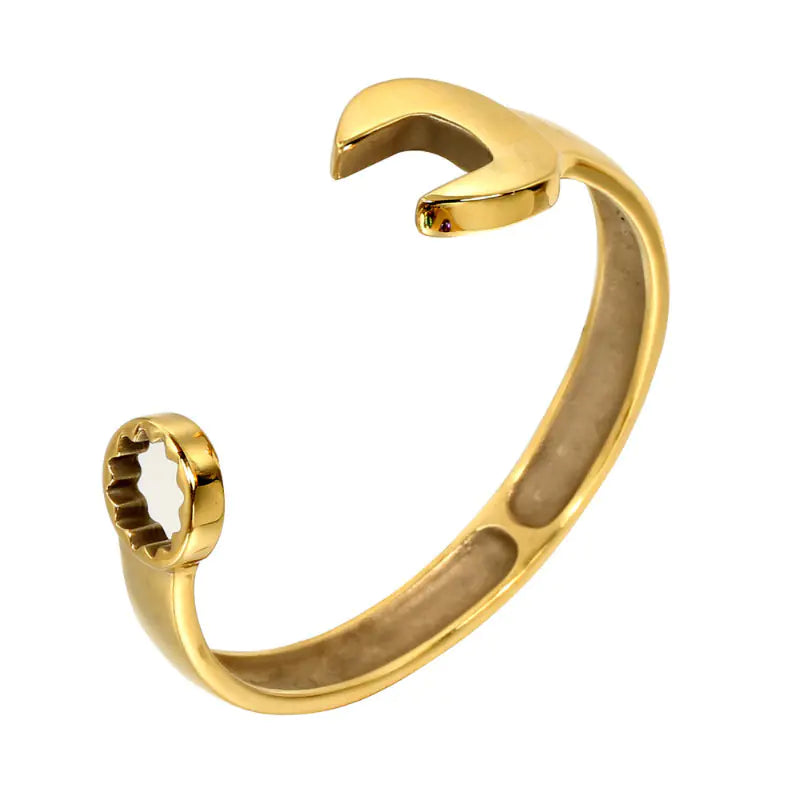A gold-colored stainless steel wrench bracelet with a simple and modern design, displayed against a white background.