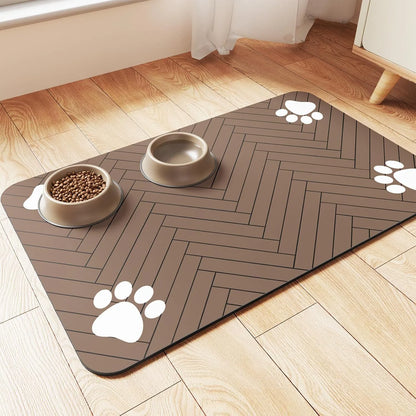 A black pet feeding placemat with a non-slip design, featuring bowls of food and water placed on top.