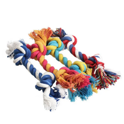 A multicolored cotton rope dog toy with knots and frayed ends, laid out on a white background.