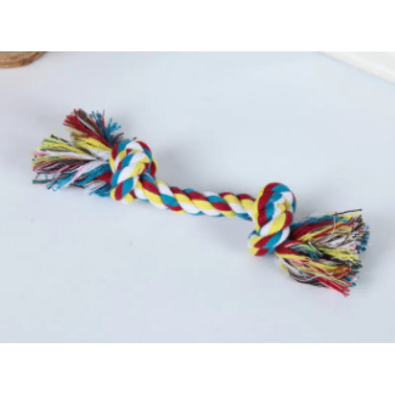 A multicolored cotton rope dog toy with knots and frayed ends, laid out on a white background.