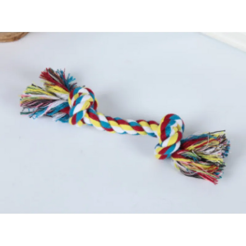 A multicolored cotton rope dog toy with knots and frayed ends, laid out on a white background.