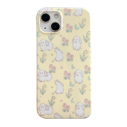 A white iPhone 15 case with a 3D floral and rabbit pattern designed for women and girls.