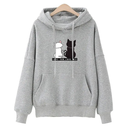 A pink hoodie with a graphic of a white cat and a black cat on the front, along with the text 'Korean style'.