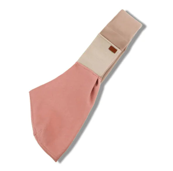 A portable crossbody cat carrier bag in navy blue with a brown leather accent.