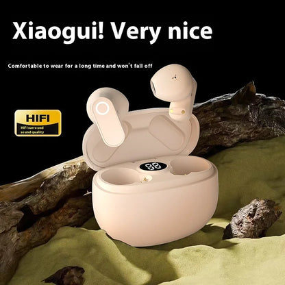 A pair of beige ear hook Bluetooth headphones displayed in an open charging case, with a descriptive text 'Xiaogui! Very nice' and additional product attributes mentioned.
