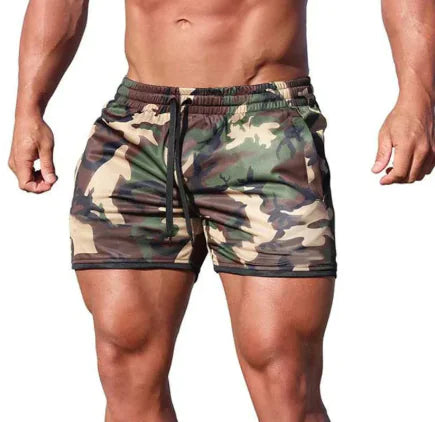 A man wearing green QuickFit sports shorts, showcasing his muscular physique.