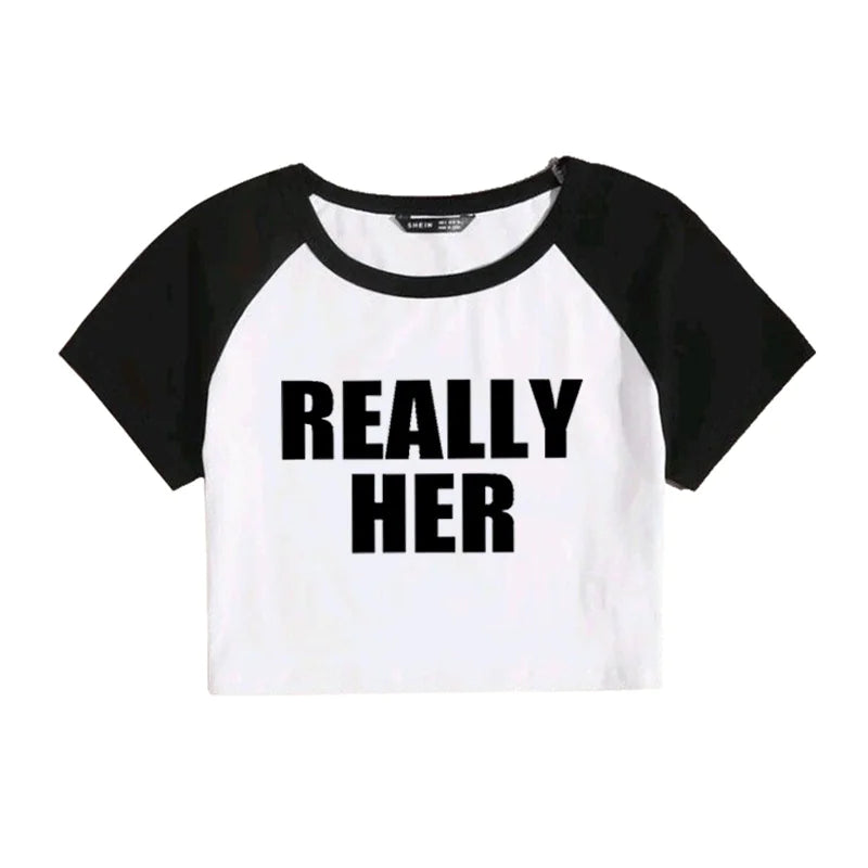 A gray and black cropped t-shirt with the text 'REALLY HER' printed in black on the front.