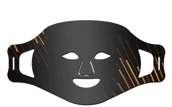 A black silicone face mask with cut-outs for the eyes and nose, featuring gold accents on the design.
