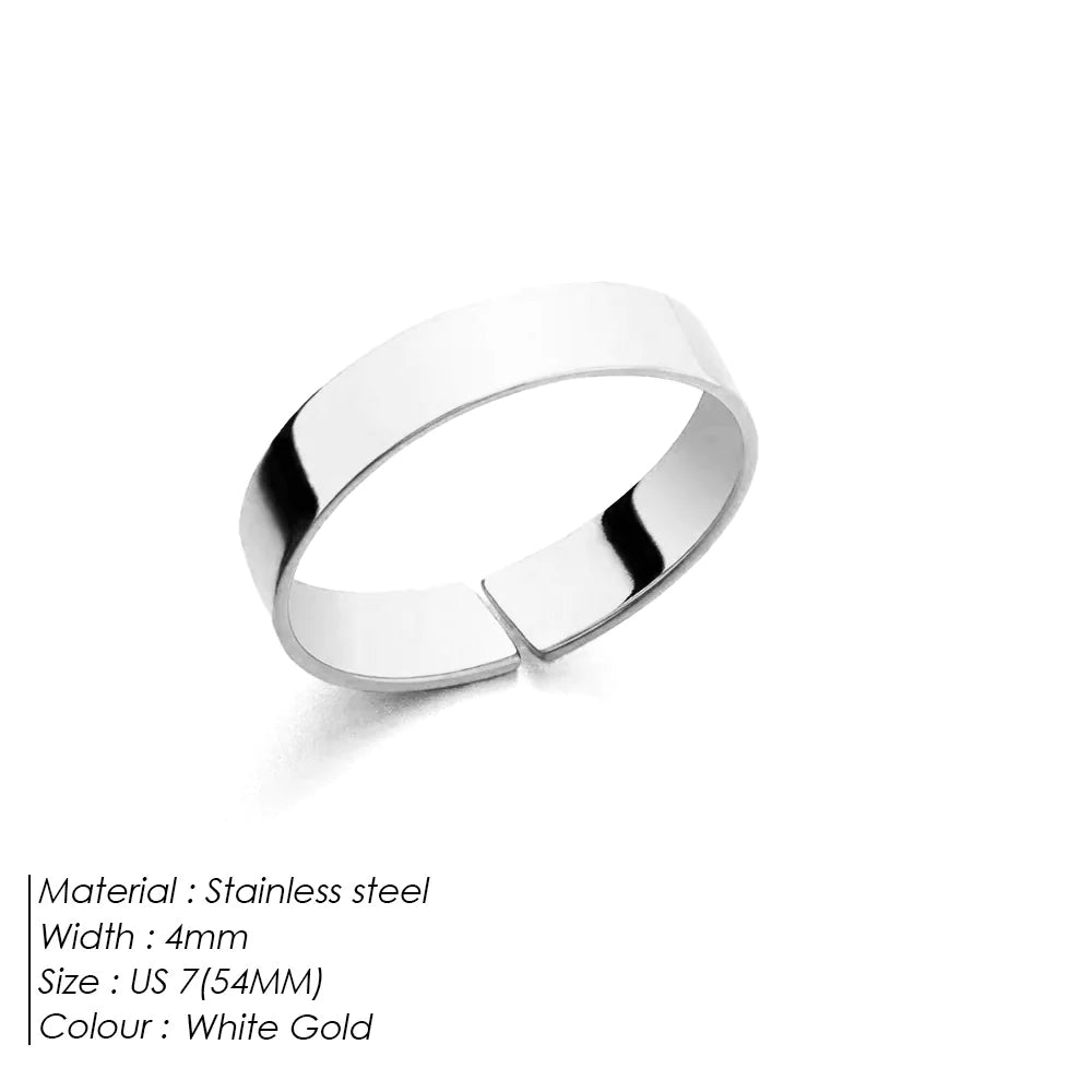 A polished titanium steel ring with a simple, open-mouth design, featuring a 18K Gold electroplated finish.